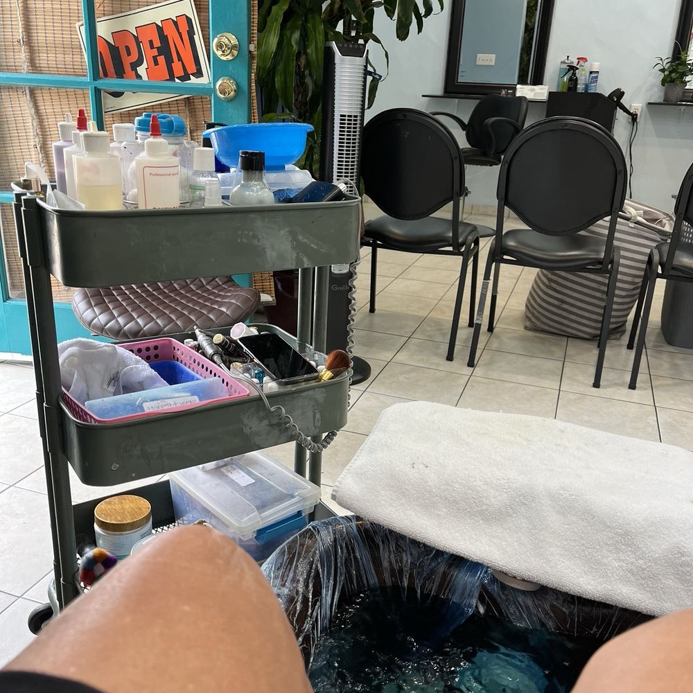 Sabrina Full Service Salon & Boutique interior showcasing a modern hair salon station in Santa Barbara, CA